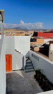 a stairway leading up to a white building at Chic Surf House in Aourir +57 photos