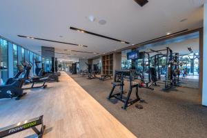 a gym with treadmills and machines in a building at Luxury 1BR Apt Best view Infinity Pool Burj Khalifa with Balcony in Dubai