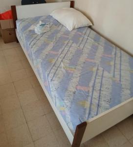 Llit o llits en una habitació de Central Apartement