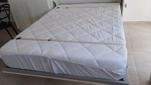 a mattress on a bed frame in a room at Estudio Urbano in Santa Rosa