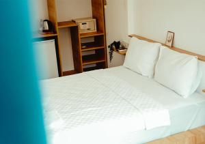 Postel nebo postele na pokoji v ubytování Deniz Otel