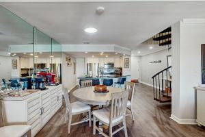 a kitchen and dining room with a table and chairs at Harbourside 7127 in Hilton Head Island