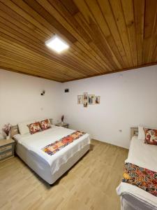 Postel nebo postele na pokoji v ubytování Özdemir Otel Datça
