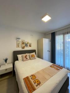 Postel nebo postele na pokoji v ubytování Özdemir Otel Datça