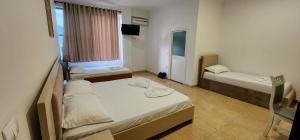 Voodi või voodid majutusasutuse Hotel Kleo toas