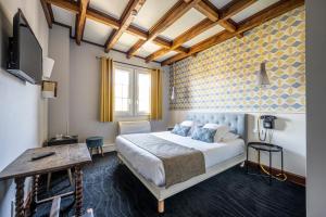 Postel nebo postele na pokoji v ubytování Hôtel Ithurria - Teritoria