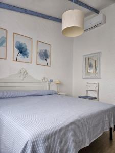 Postel nebo postele na pokoji v ubytování La Casetta Cannigione