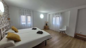 En eller flere senge i et værelse på Casa del Mar