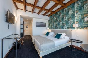 Postel nebo postele na pokoji v ubytování Hôtel Ithurria - Teritoria