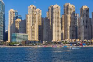 a view of a city with a beach and tall buildings at Hilton Dubai The Walk in Dubai