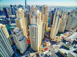 an aerial view of a city with tall buildings at Hilton Dubai The Walk in Dubai