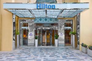 an entrance to a hotel with the doors open at Hilton Dubai The Walk in Dubai