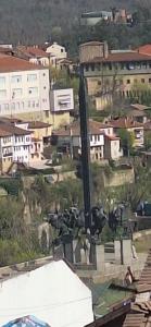 an aerial view of a city with a herd of cows at Mint 2 in Veliko Tŭrnovo