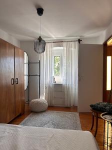 a bedroom with a bed and a window at Casa della Nonna in Škrljevo +10 photos