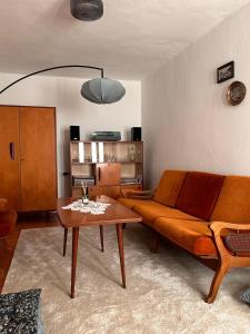 a living room with a couch and a table at Casa della Nonna in Škrljevo