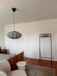 a living room with a bed and a lamp at Casa della Nonna in Škrljevo