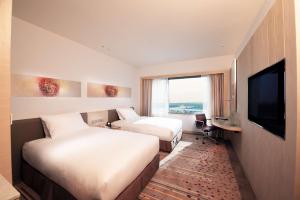 DoubleTree by Hilton Johor Bahru客房内的一张或多张床位