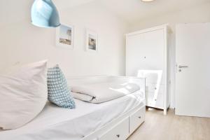 En eller flere senge i et værelse på Wohnpark Niendorf 13 Wohnpark Niendorf Appartement 6