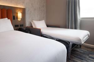 Postel nebo postele na pokoji v ubytování Hilton Leeds City