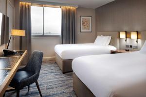 Postel nebo postele na pokoji v ubytování Hilton Leeds City