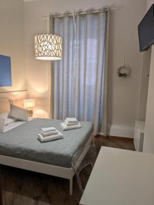 Posteľ alebo postele v izbe v ubytovaní Gracchi 278 - The Italian Stay Collection