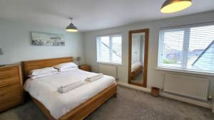 Ένα ή περισσότερα κρεβάτια σε δωμάτιο στο Gwel Angarder