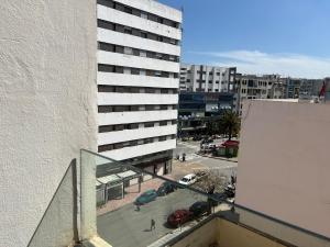 a view of a tall building from a balcony at Résidence Eden in Kenitra