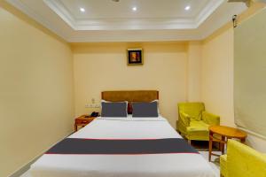 Postel nebo postele na pokoji v ubytování Super Hotel O G Silver Ashok Nagar