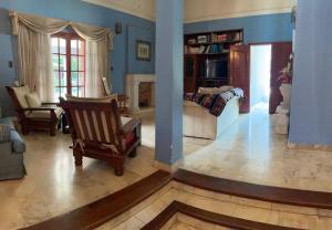 a living room with a couch and a fireplace at casa Salta in Salta