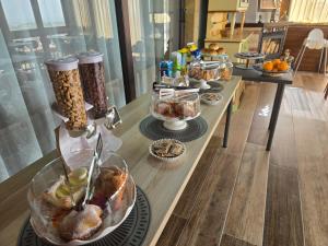 a buffet of food on a long table at BeB Villa Ylenia in Agrigento +67 photos