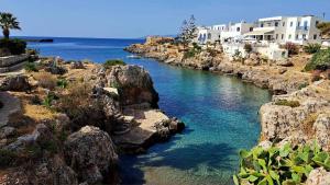 a view of a river with rocks and houses at VISTA MARE Kythera House in Agia Pelagia +44 photos