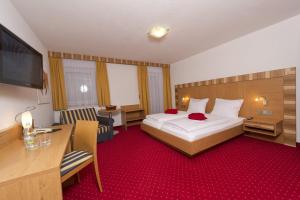 Postel nebo postele na pokoji v ubytování Pension Appartement Lanzer