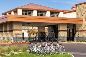 a group of bikes parked in front of a building at Hilton Scottsdale Resort & Villas in Scottsdale