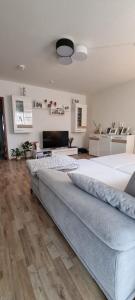a large bedroom with a large bed and wooden floors at BS Business Travelling Hannover Messe in Hannover