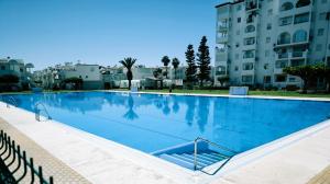 a large swimming pool in front of some buildings at Cayo Beach in Torrox Costa +26 photos