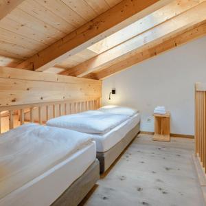 Rúm í herbergi á Hotel Spitzhorn Superieur