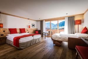 Rúm í herbergi á Hotel Spitzhorn Superieur