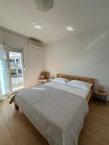 Postel nebo postele na pokoji v ubytování Apartments Zulim