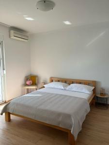 Postel nebo postele na pokoji v ubytování Apartments Zulim