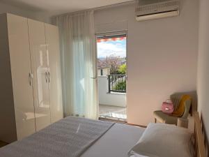 Postel nebo postele na pokoji v ubytování Apartments Zulim