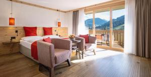 Rúm í herbergi á Hotel Spitzhorn Superieur