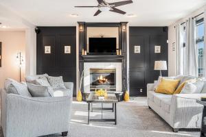 a living room with two couches and a fireplace at Furnished 5 BR Executive Rental in Omaha