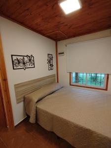 Postel nebo postele na pokoji v ubytování Cabañas SOL SERRANO + 22 fotografií