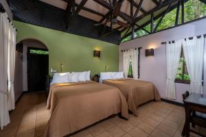 Postel nebo postele na pokoji v ubytování Maquenque Ecolodge
