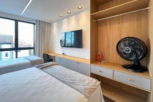 En eller flere senge i et værelse på Intermares Moderno Studio 3 pessoas 300m Praia + 17 billeder