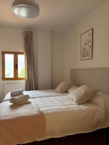 a bedroom with a bed with two pillows on it at Casa Tramontana CR Los Cuatro Vientos in Moratalla +15 photos
