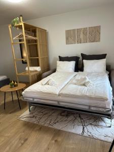 Postel nebo postele na pokoji v ubytování Stilvoll, am Thuner See, nähe Interlaken, Familienfreundlich mit Garten, WIFI