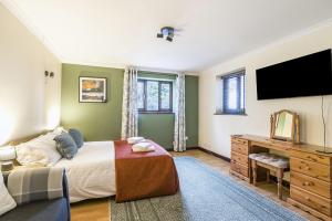 Voodi või voodid majutusasutuse Grove Lodge toas