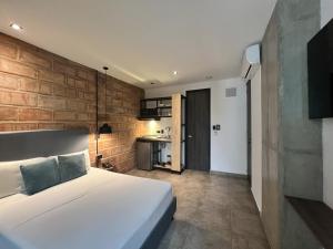 Postel nebo postele na pokoji v ubytování Apartahotel con Piscina