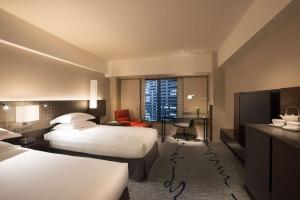Postel nebo postele na pokoji v ubytování Hilton Tokyo Hotel